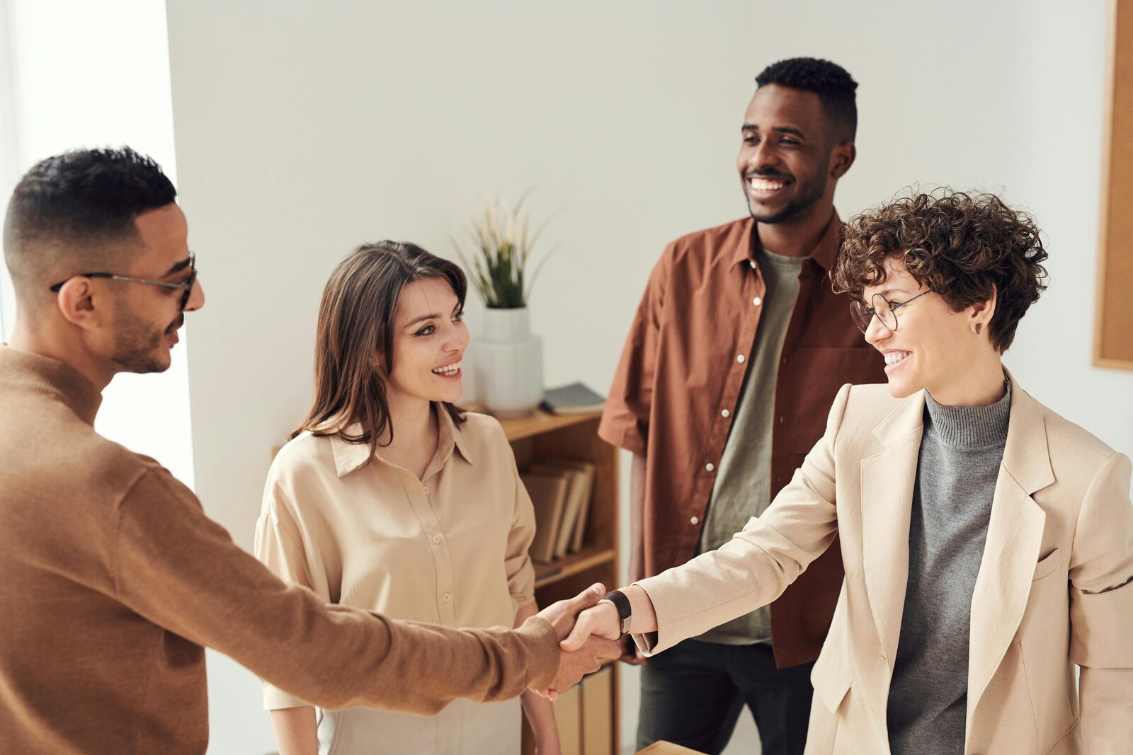 People shaking hands in an office